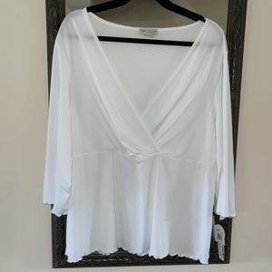 White, faux wrap, 3/4 sleeved, ruffle-edged top—a wardrobe staple. Size 2X.